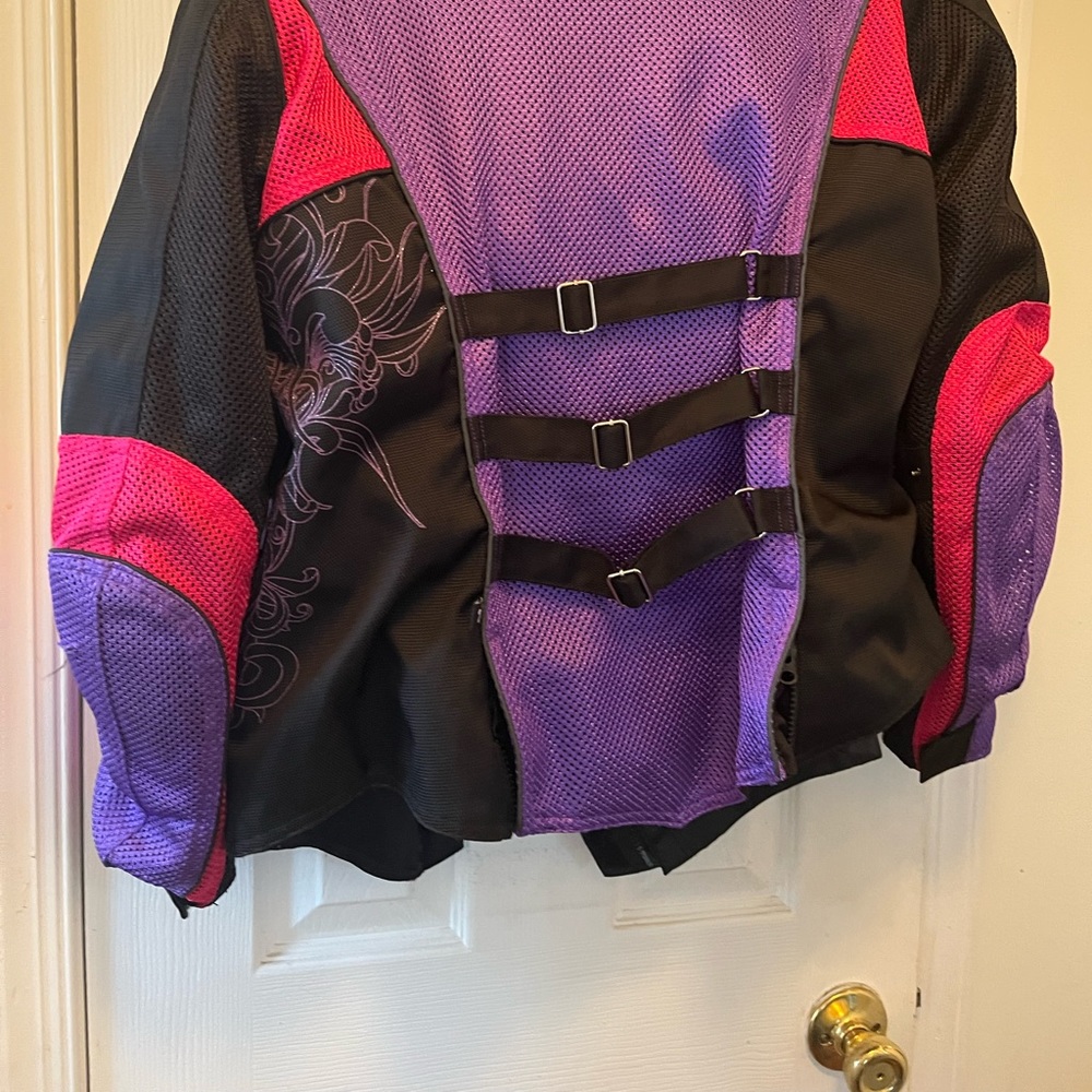 Woman’s like new motorcycle jacket! Love this- a feminine touch with etching.